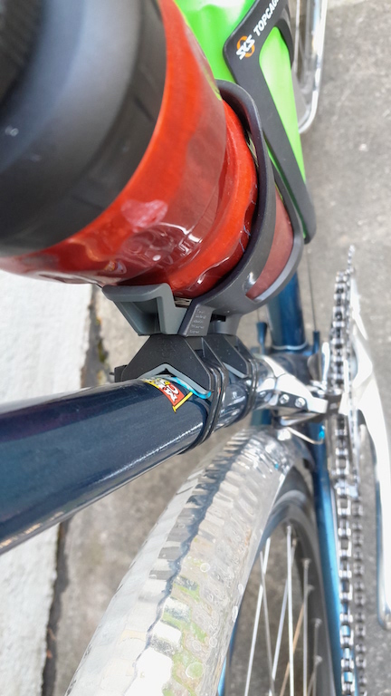 View of the seat-tube cage from above, showing how the Anywhere mountings are quite bulky and set the cage further from the tube than a mounting via brazed-on bosses.
